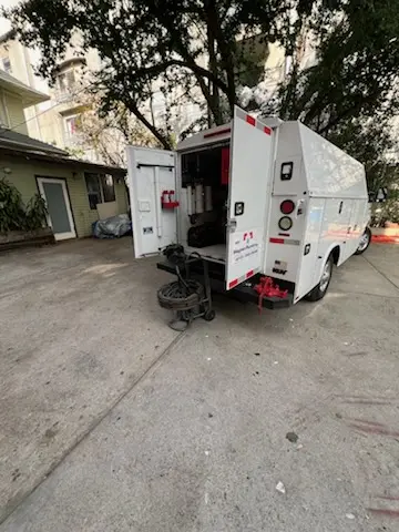 Magnet Plumbing service vehicle on-site for Grease Trap Cleaning in Sunset Beach